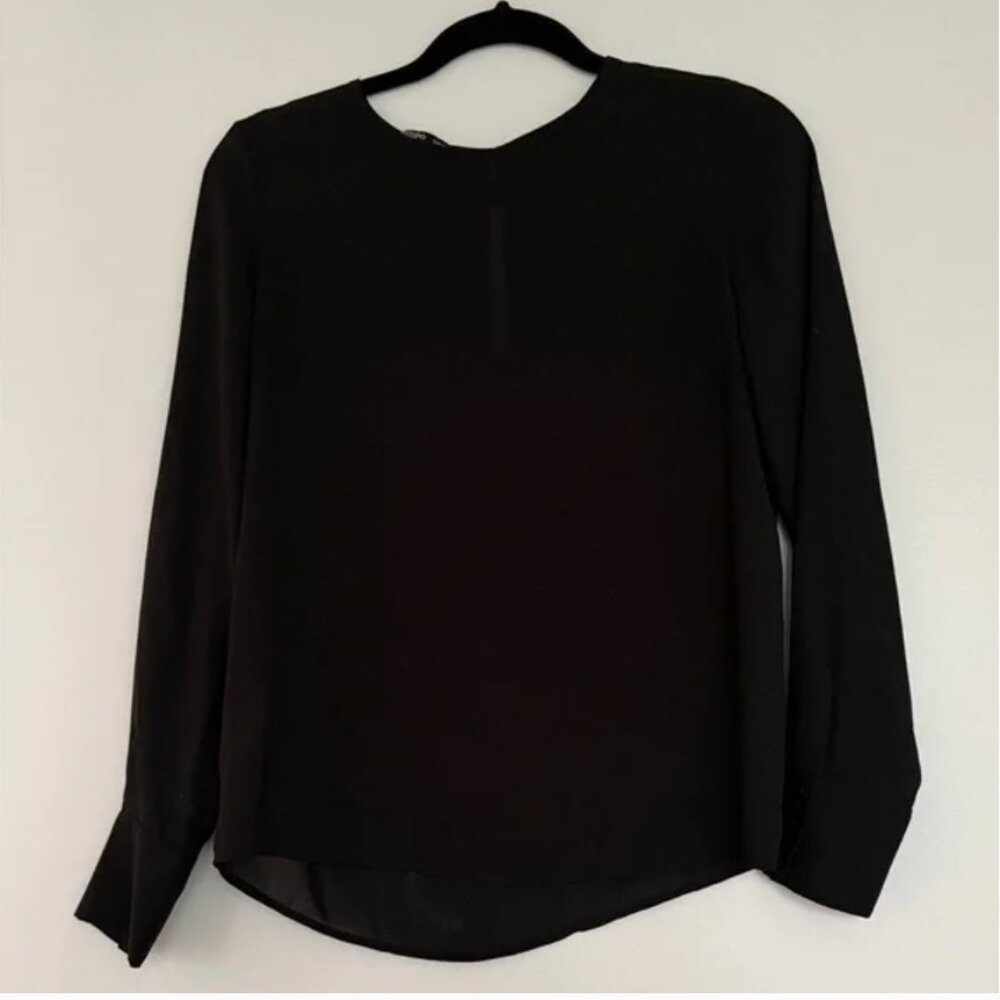 Elegant black blouse from Mango in Italy